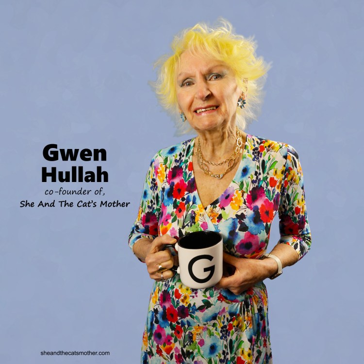 2021 profile photo of Gwen Hullah; wearing a flowered dress in front of a light blue background